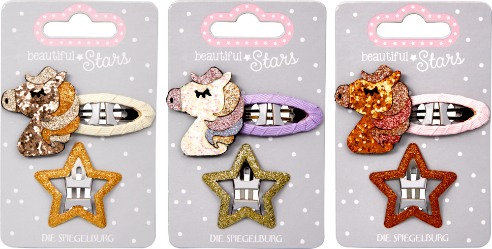 Set mit 3 Einhorn- und Stern-Haarspangen in Gold, Lila und Pink auf dekorativer Verpackung.