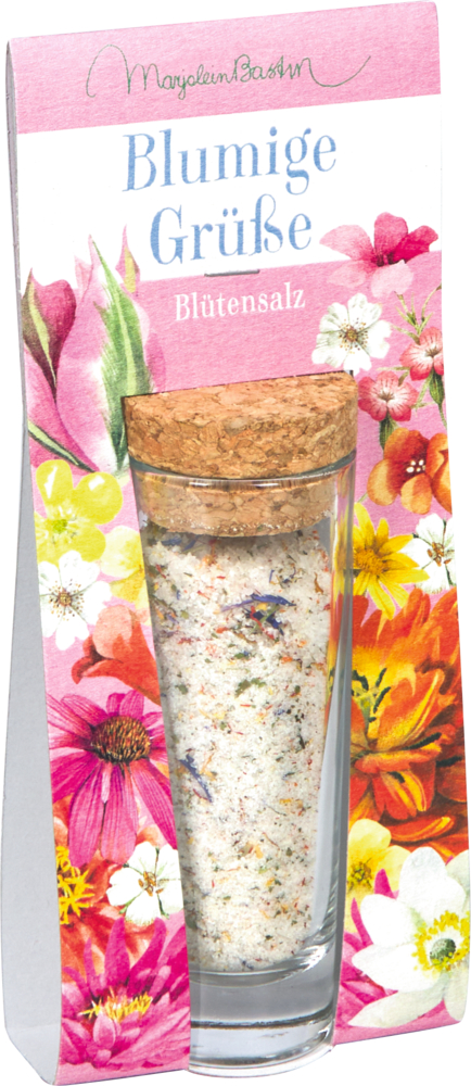 Ein Glasröhrchen Blütensalz und Korken in rosa Verpackung mit floralem Muster.