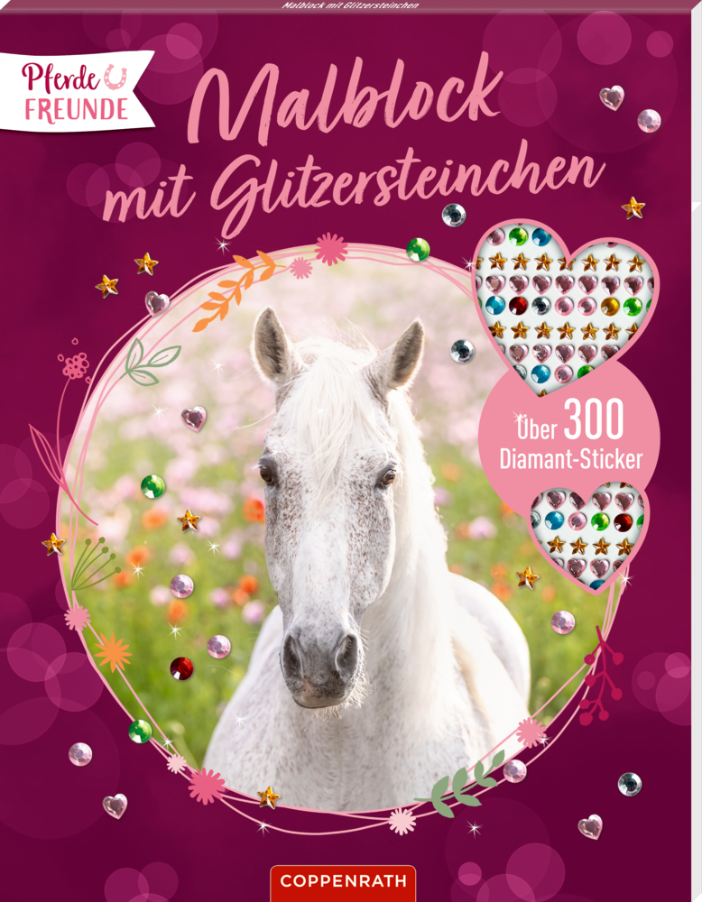 Weißes Pferd auf einer Weide auf einem rosa Kunstblock-Umschlag mit bunten Edelsteinaufklebern und Text.