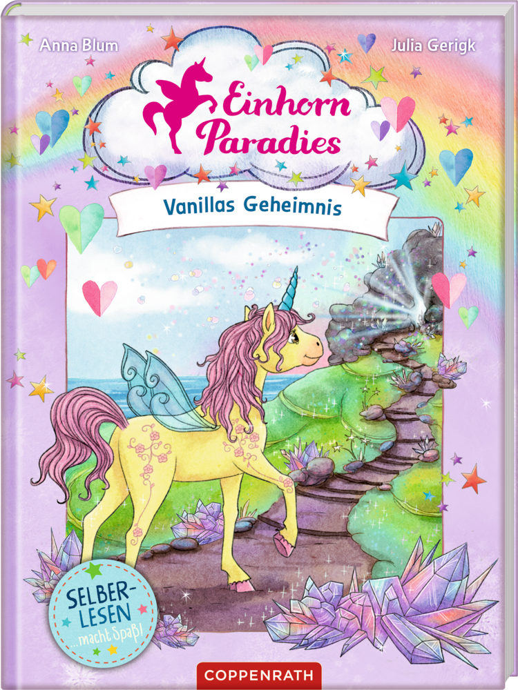 Gelbes Einhorn mit lila Mähne steht bei funkelnden Steinen unter Regenbogenhimmel, auf dem Buchcover von "Einhorn Paradies - Vanillas Geheimnis".