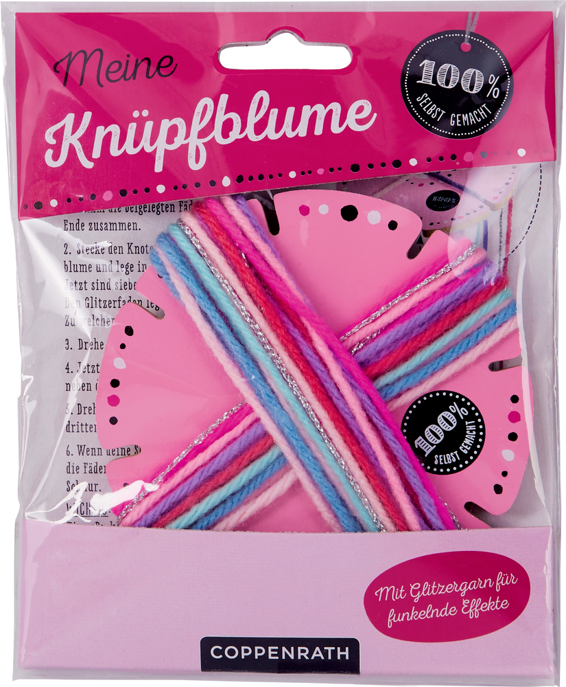 Meine Knüpfblume Bastelset in pinker Verpackung mit buntem Garn und einem sichtbaren blumenförmigen Werkzeug im Inneren.