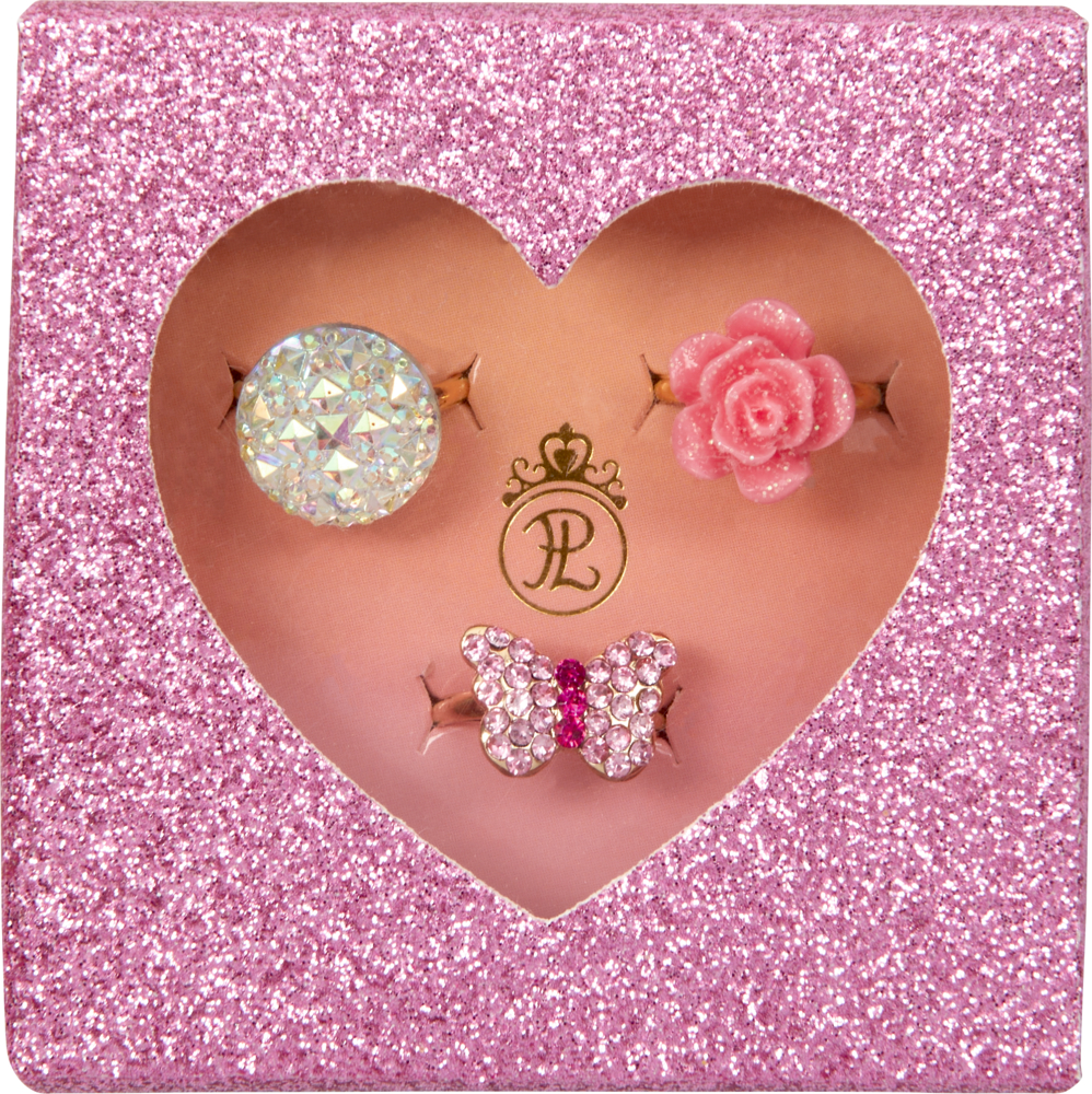 Set aus drei dekorativen Ringen in einer glitzernden rosa herzförmigen Box mit Juwelen-, Blumen- und Schmetterlingsdesign.