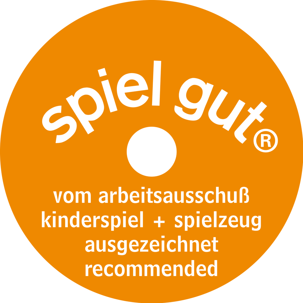 Oranger Kreis mit „spiel gut“ und deutschem Text, der ein Auszeichnungssiegel für empfehlenswertes Spielzeug kennzeichnet.