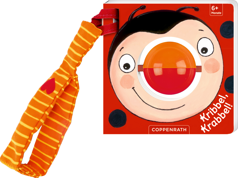 Ein Babybuch mit Marienkäferzeichnung, roter Kugelnase in der Mitte und orange gestreiftem Stoffband.