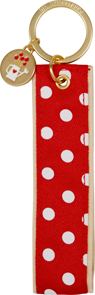 Goldener Schlüsselanhänger mit rot-weiß gepunktetem Stoff und einem mit Herzen verzierten Gießkannenanhänger.