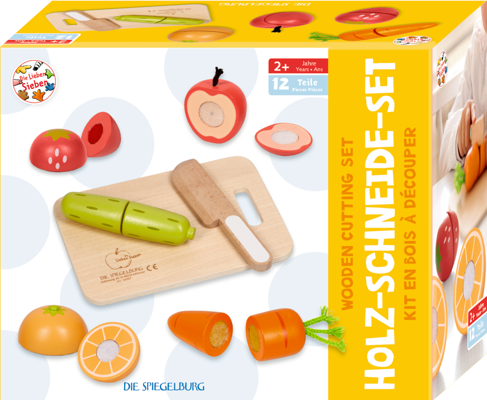 Gelbe Schachtel mit der Abbildung von Obst und Gemüse aus Holz sowie einem Schneidebrett und einem Messer aus Holz.