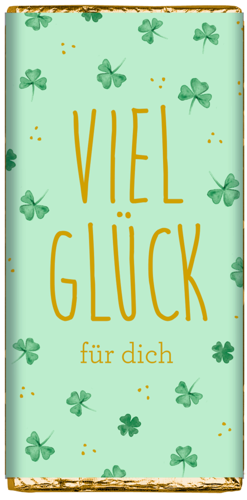 Mintgrüne Schokoladentafel mit goldener Aufschrift „Viel Glück für dich“ und verstreuten grünen Kleeblättern.