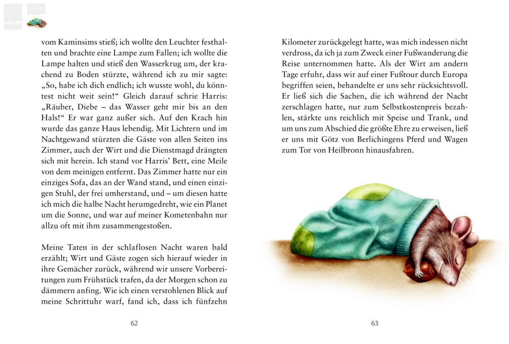Maus schläft unter grüner Decke neben Text auf weißen Seiten.