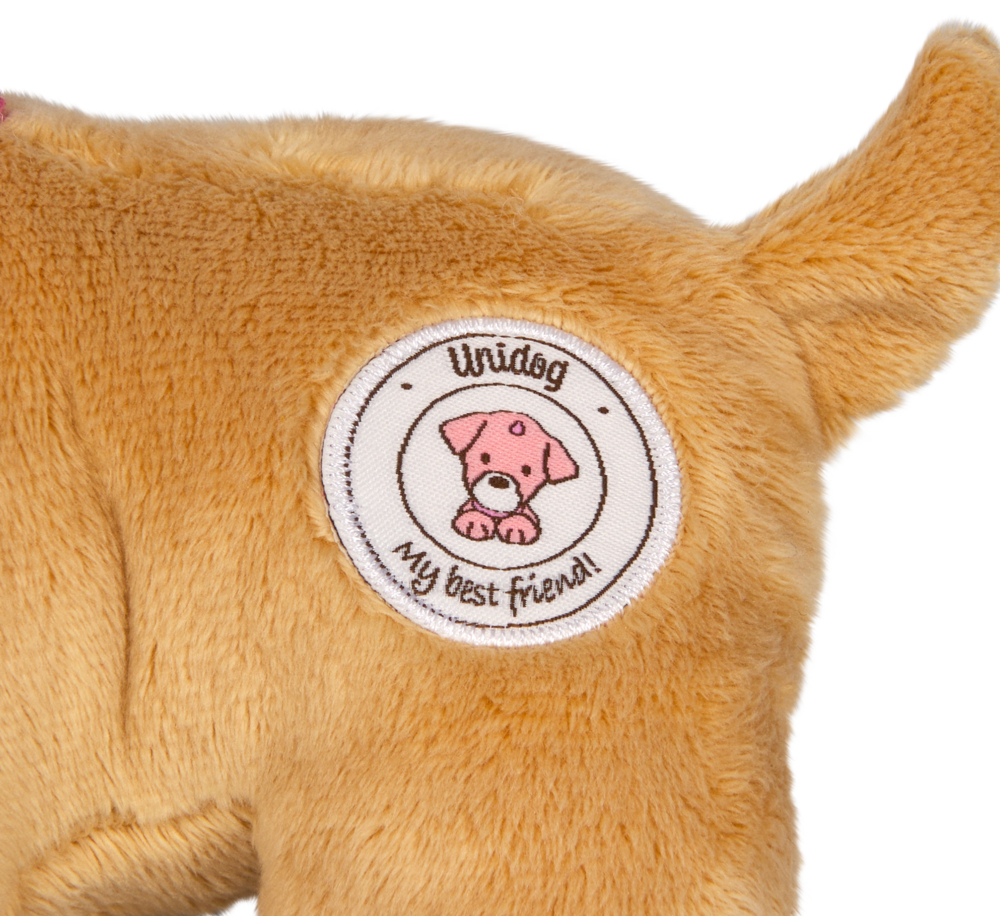 Nahaufnahme des Hinterteils eines Plüschhundes mit einem Aufnäher „Unidog, my best friend!“ und einem Cartoon-Hundebild.
