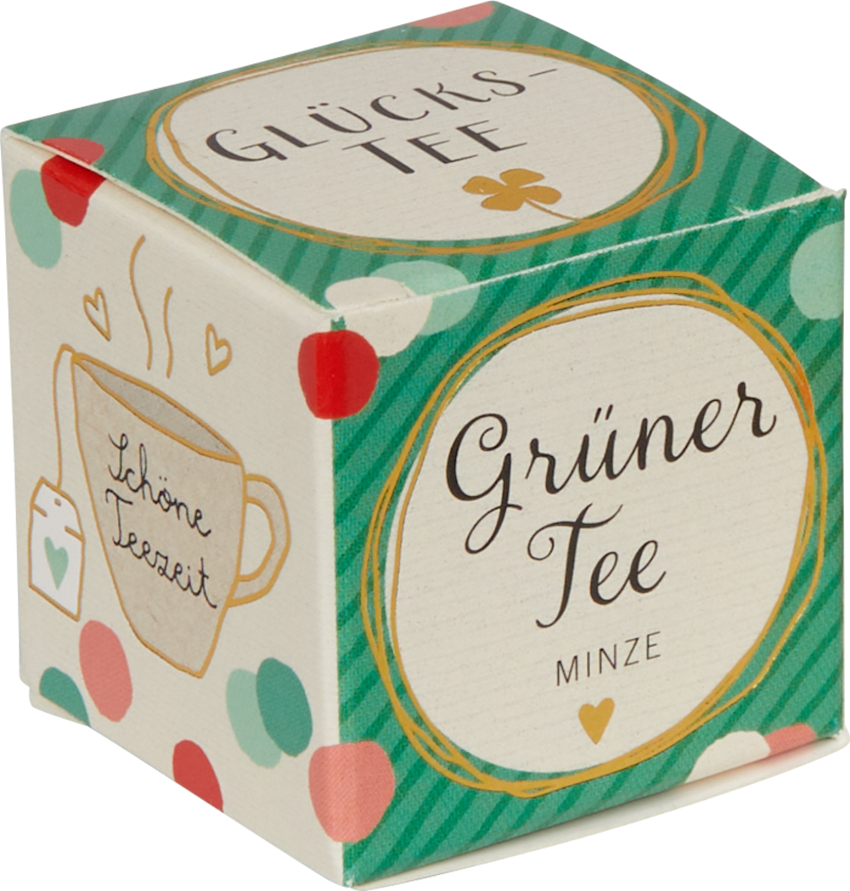 Grüne, kleine Pappbox mit der Aufschrift Grüner Tee Minze mit Tupfen und einer Teetassen-Illustration.