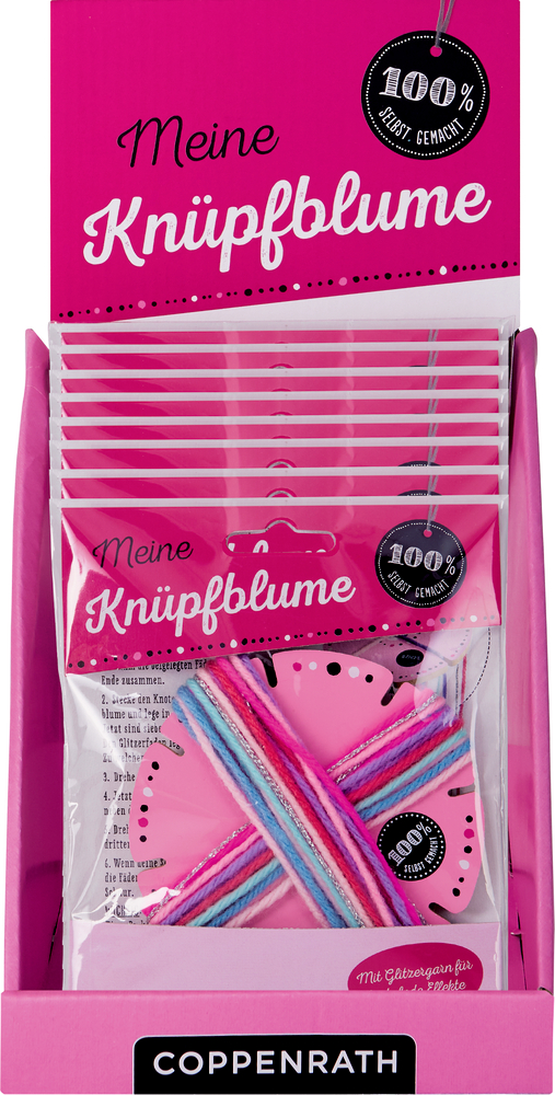 Rosafarbene Displaybox mit Meine Knüpfblume-Sets, jedes mit Garn und einem rosafarbenen, blumenförmigen Werkzeug zum Basteln.