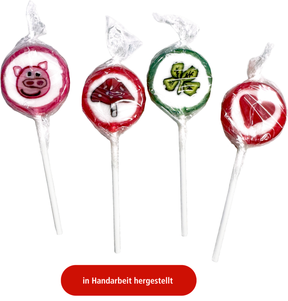 Vier runde Lollis mit Motiven von Schwein, Pilz, Kleeblatt und Herz in transparenter Folie verpackt.