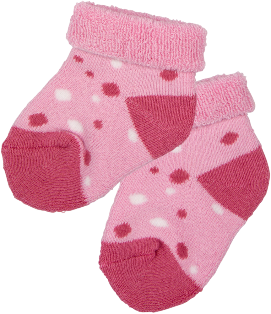 Rosa Babysocken mit dunkelrosa Zehen- und Fersenpartie und weißen und rosa Punkten.