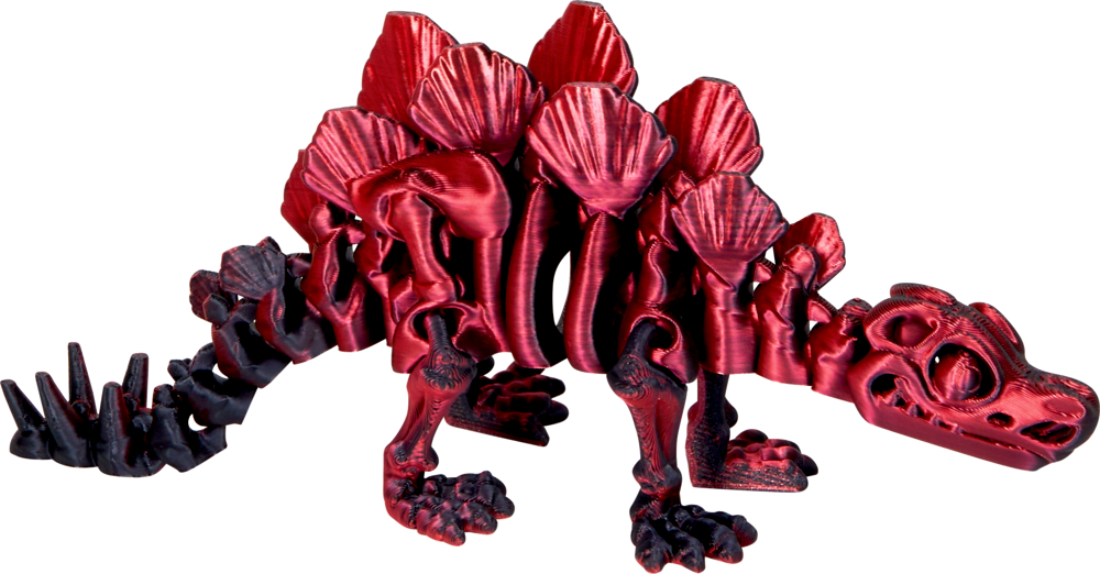 Rot-schwarzer Spielzeug-Stegosaurus mit großen Rückenplatten und Schwanzstacheln, dargestellt auf weißem Hintergrund.