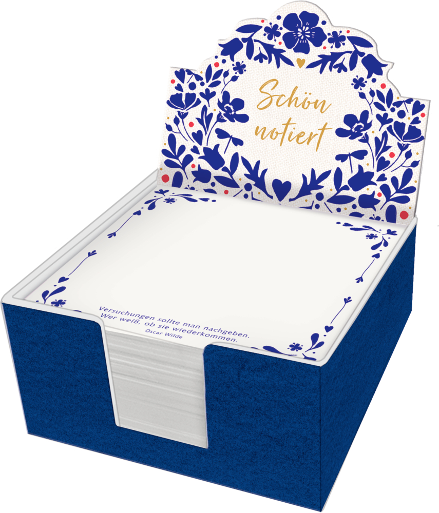 Quadratische Notizzettel in blauer Box mit floralem Muster und der Aufschrift „Schön notiert“ auf der Rückwand.