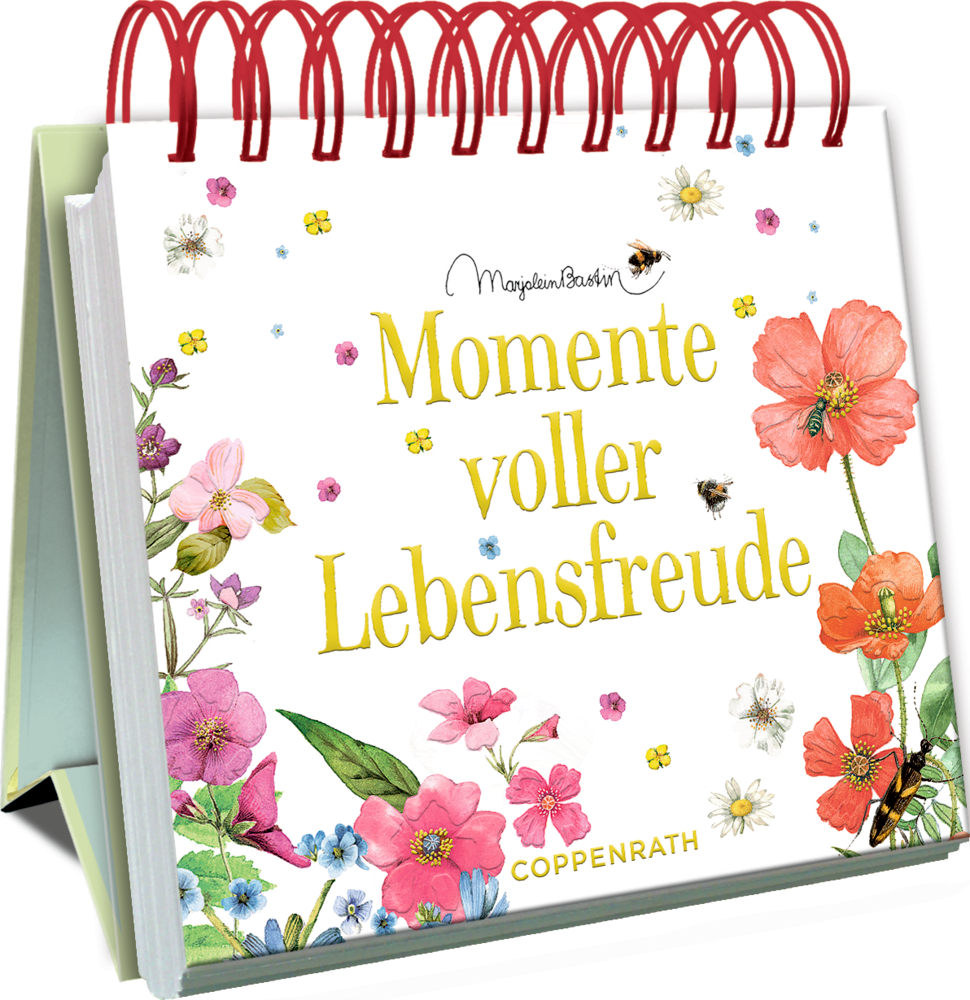 Spiralaufstellbuch mit floralen Motiven und dem  Satz „Momente voller Lebensfreude“ auf dem Cover.