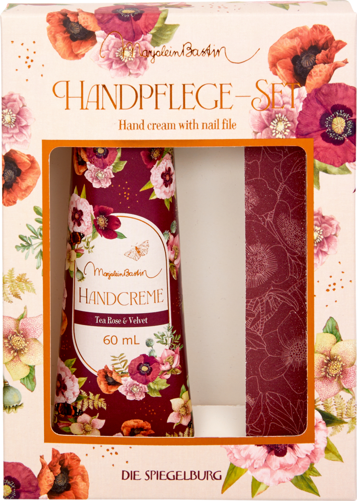 Mit Blumen verzierte Pappschachtel mit Sichtfenster. Darin sind eine dunkelrote Pfeile und eine Cremetube zu sehen.
