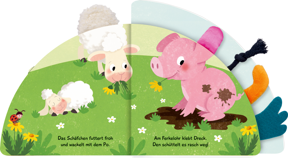 Aufgeschlagenes Pappbilderbuch mit Illustration eines Ferkels und zweier Schafe auf einer Wiese. Darüber einige Fühlelemente.