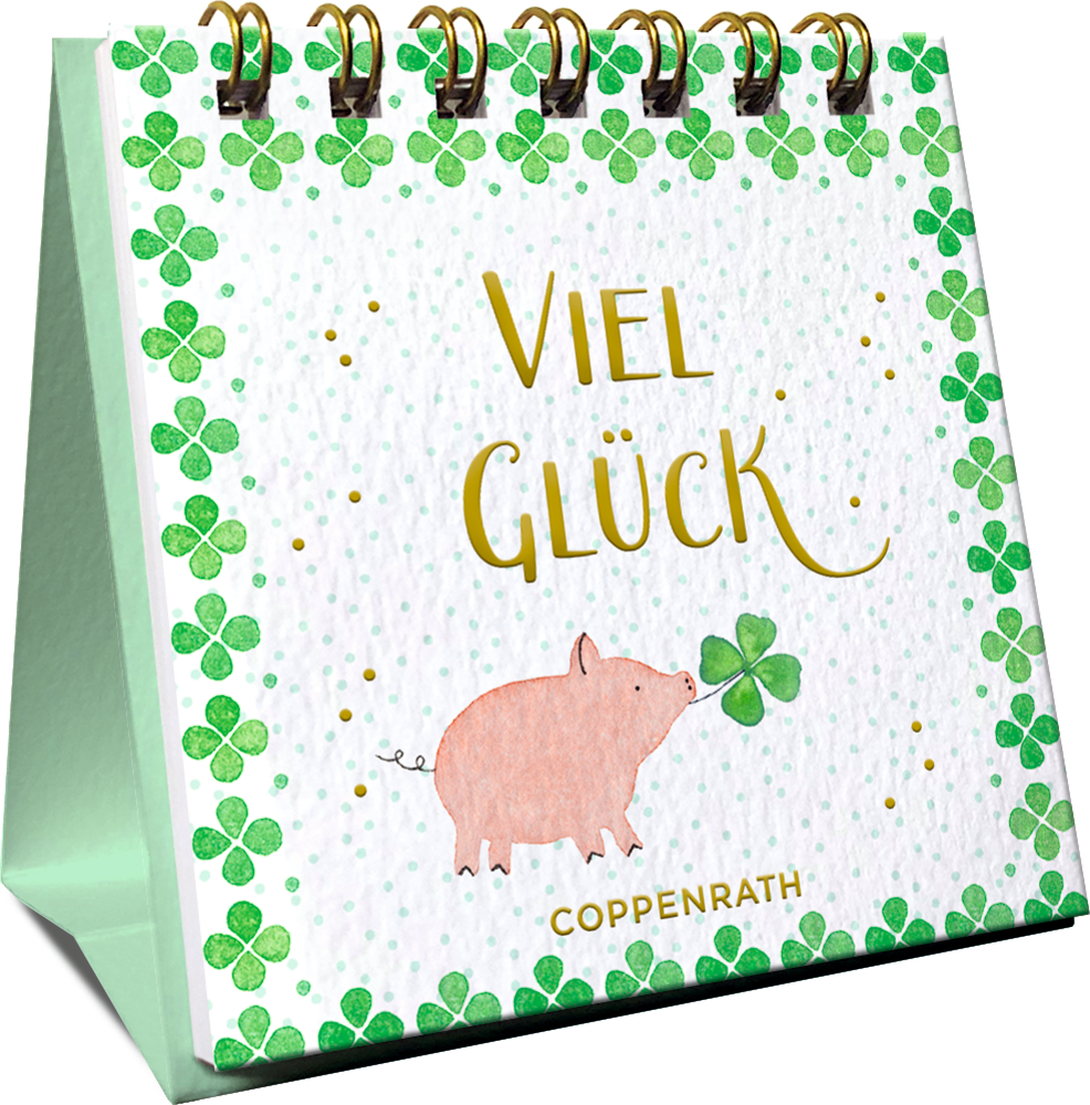 Spiralgebundener Tischkalender mit Kleeblättern und einem Schwein. In goldener Schrift der Text "viel Glück".