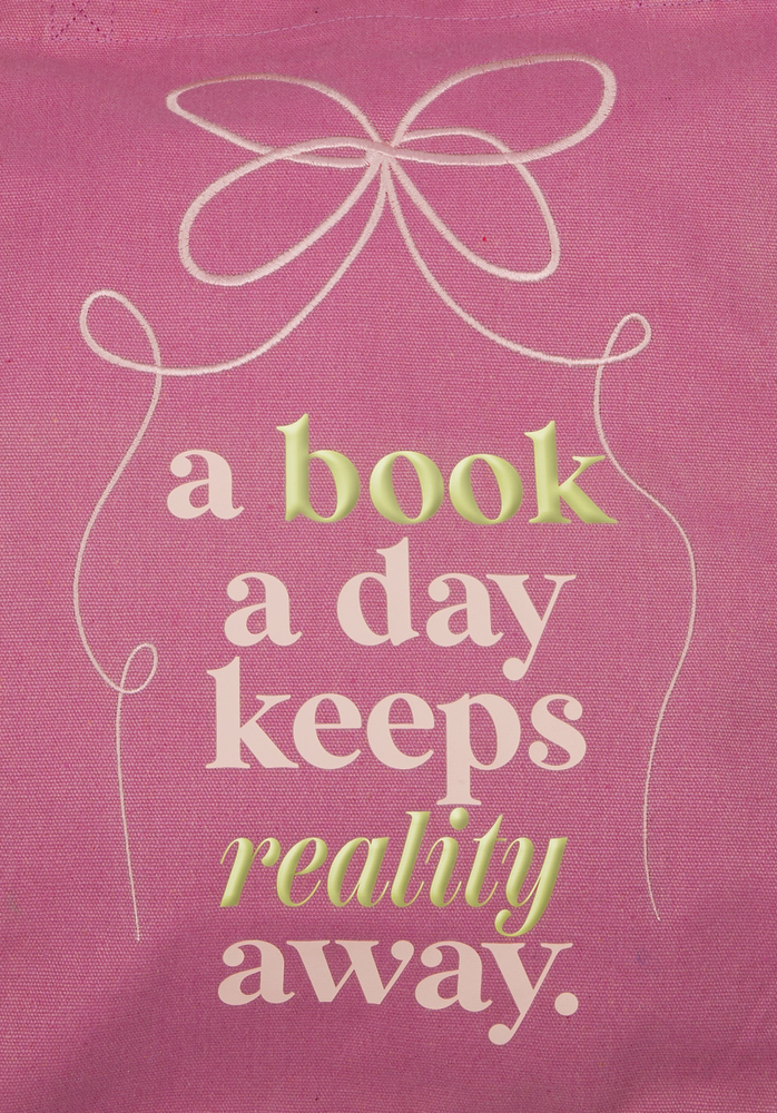 Rosa Hintergrund mit einer Schleife und dem Text: a book a day keeps reality away.