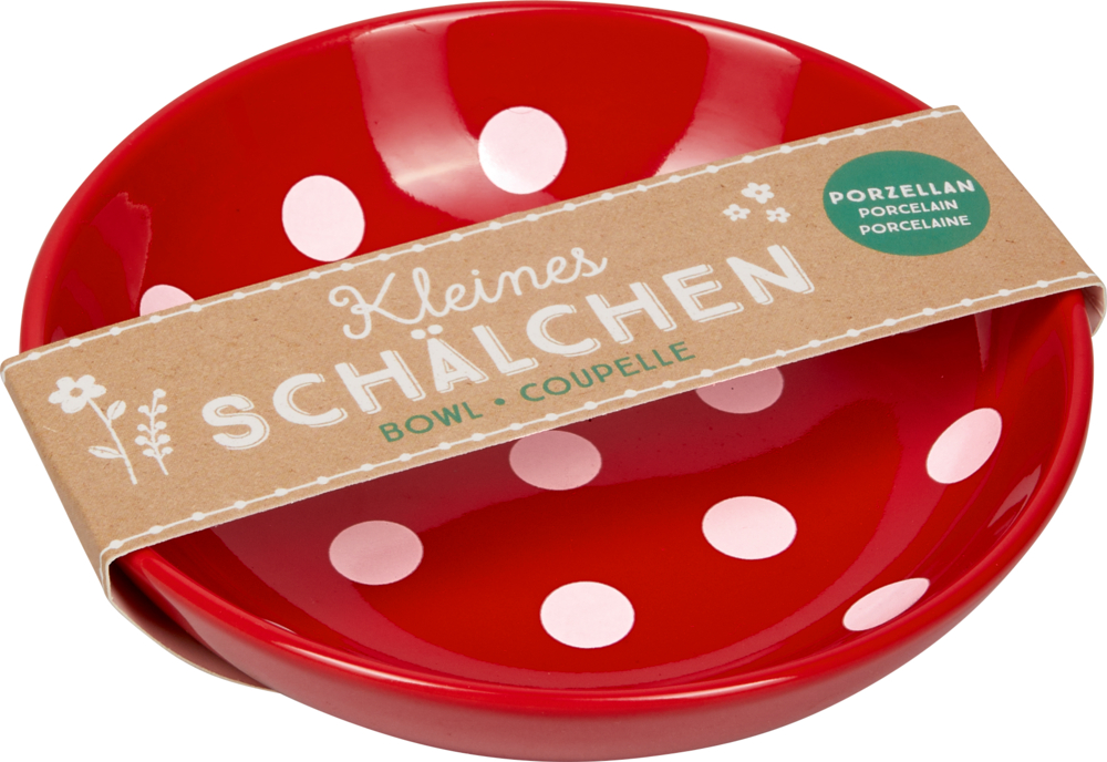 Rote Schale mit weißen Punkten, braunes Papieretikett mit der Aufschrift: „Kleines Schälchen, Porzellan“.