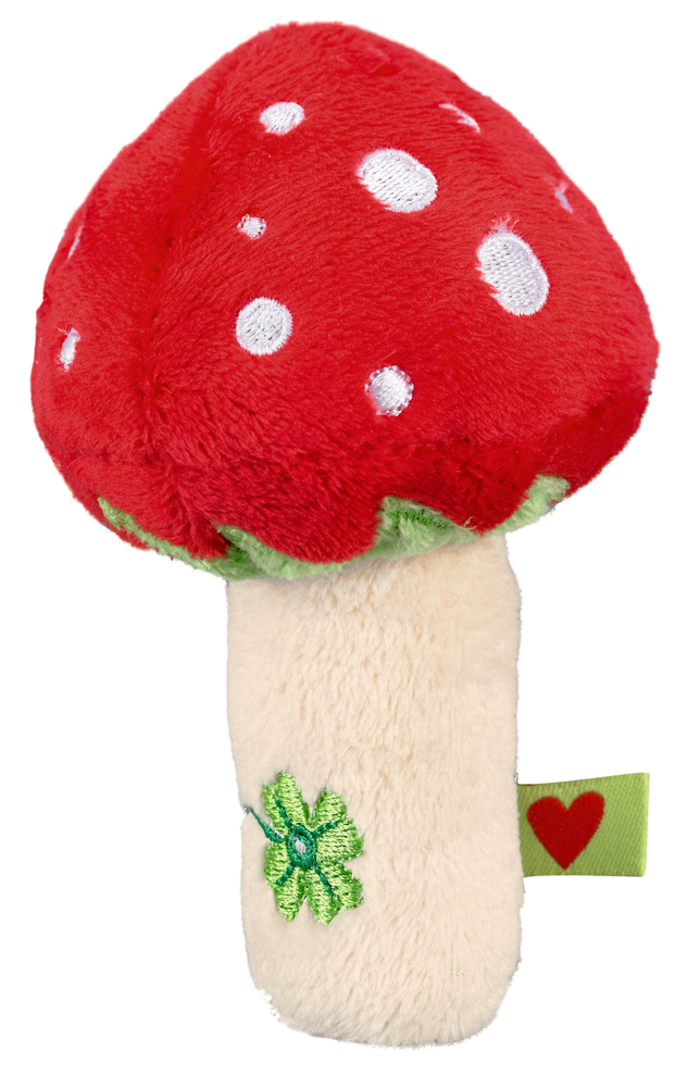 Plüschiger rot-weißer Fliegenpilz mit cremefarbenem Stiel, grünem Kleeblatt und einem grünen Etikett mit einem roten Herz.