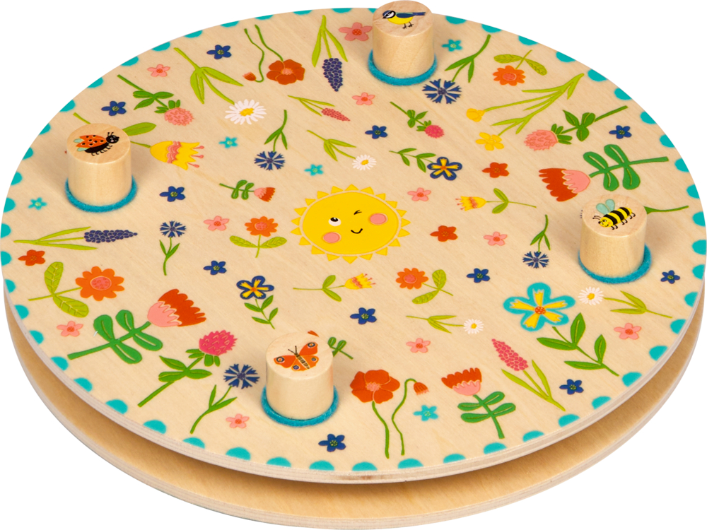 Rundes Blumenpresse aus Holz mit Blumen, lächelnder Sonne, Bienen und Schmetterlingen.