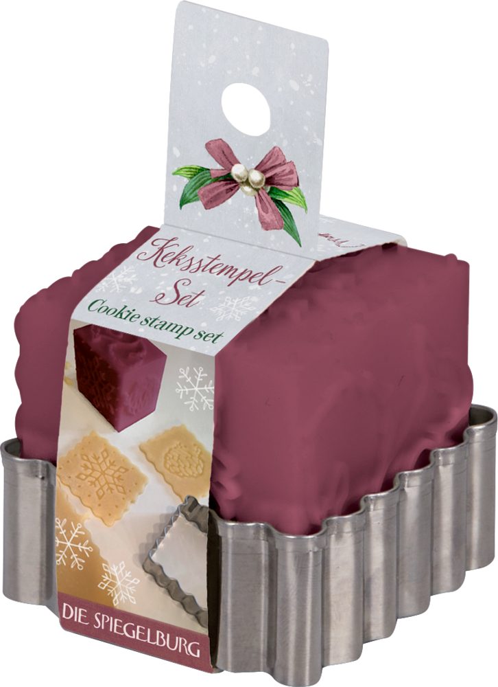 Keksstempel-Set mit bordeuxfarbenem Stempel und silberner gewellter Ausstechform mit Banderole herum.